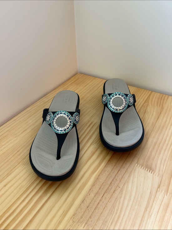 CROCS Shoes - Crocs sandal in navy blue with blue, teal, and white detailing.